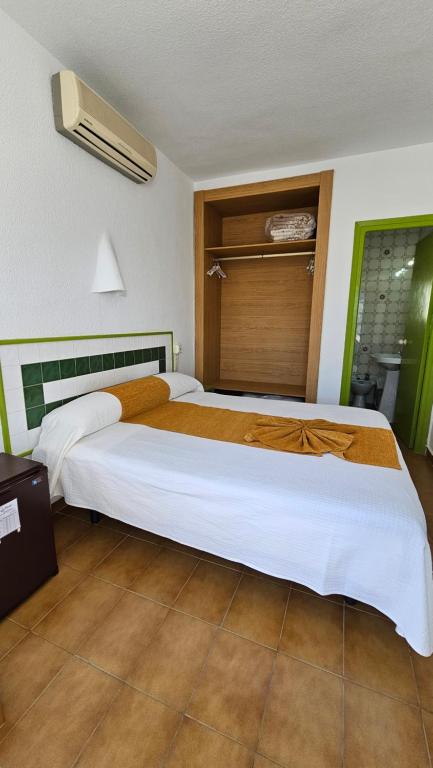 Postel nebo postele na pokoji v ubytování Hotel El Puntazo I