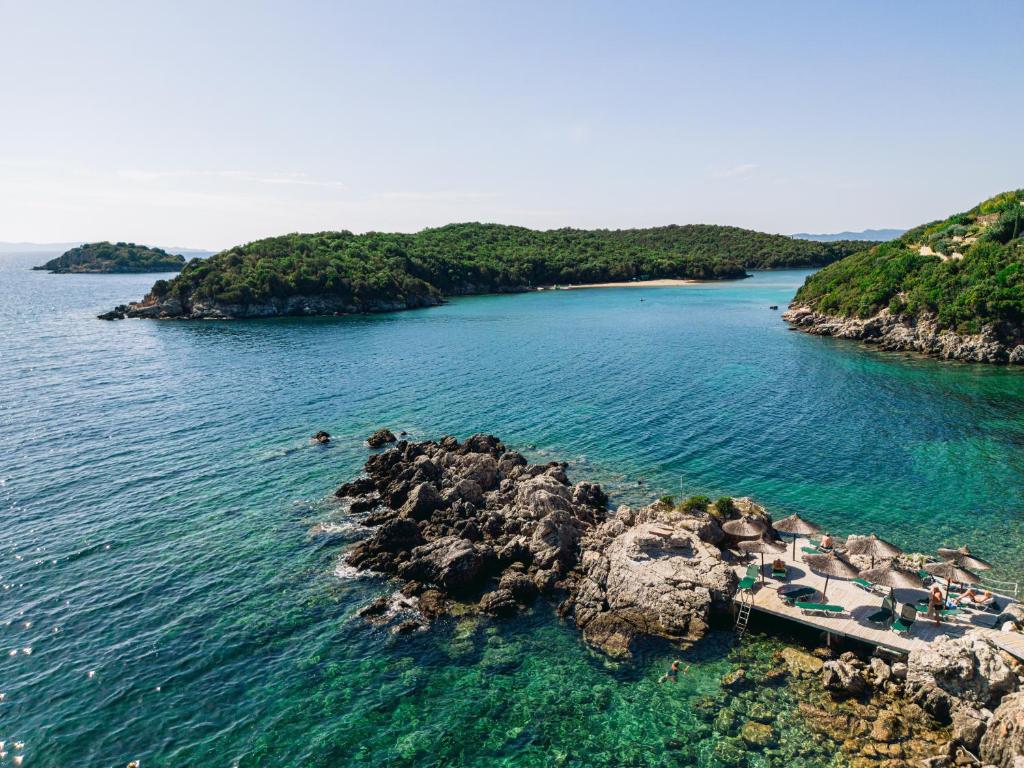an island in the middle of a body of water at Costa Smeralda in Syvota