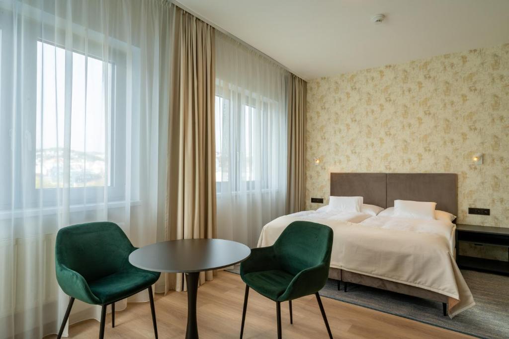 Postel nebo postele na pokoji v ubytování Hotel Tatra