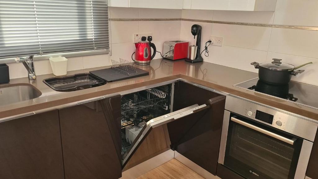 Kuchyň nebo kuchyňský kout v ubytování STAY Mystique City Penthouse