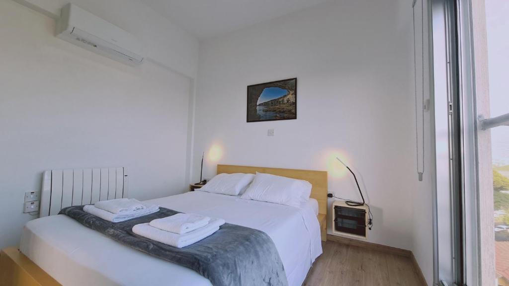 Postel nebo postele na pokoji v ubytování STAY Mystique City Penthouse
