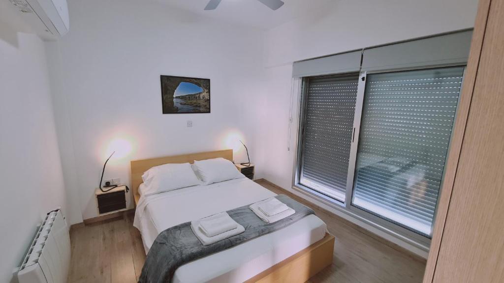 Postel nebo postele na pokoji v ubytování STAY Mystique City Penthouse