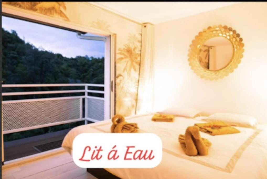 Postel nebo postele na pokoji v ubytování "La Ravine" privé, luxe, avec une vue unique
