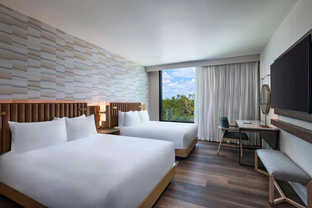 Postel nebo postele na pokoji v ubytování Hyatt Regency Conroe