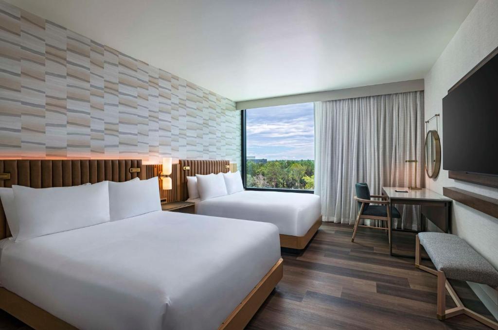 Postel nebo postele na pokoji v ubytování Hyatt Regency Conroe