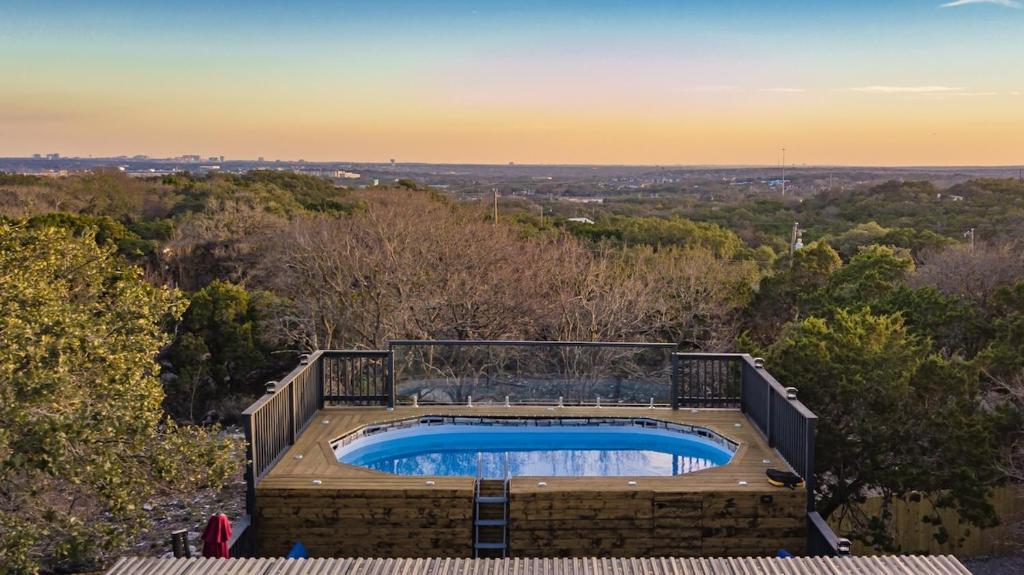 an overhead view of a swimming pool on a building at Breathtaking Roof Pool Views, Gameroom, Firepit in San Antonio