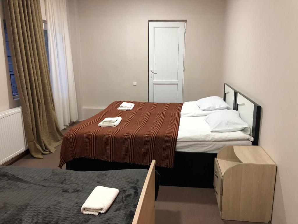 Postel nebo postele na pokoji v ubytování Guest House Vanda