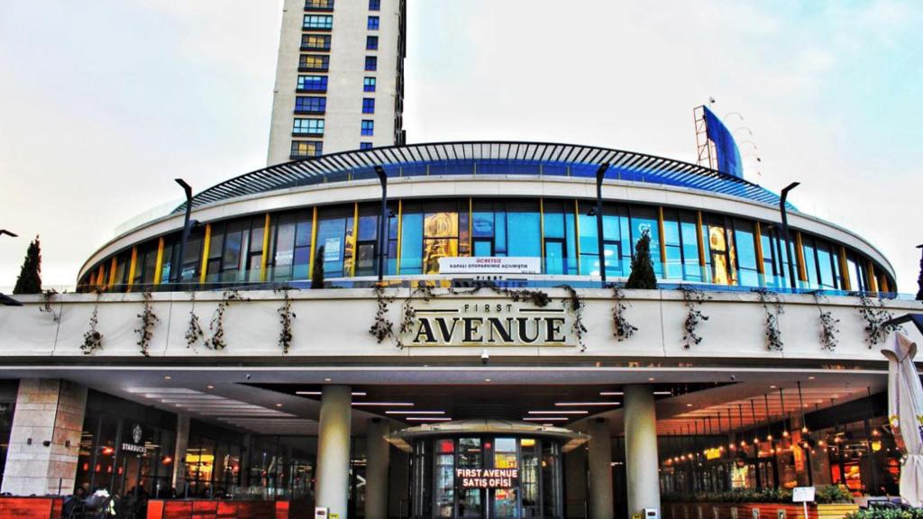 a building with a sign that reads the avenue at First Avenue Mall & Residence in Istanbul