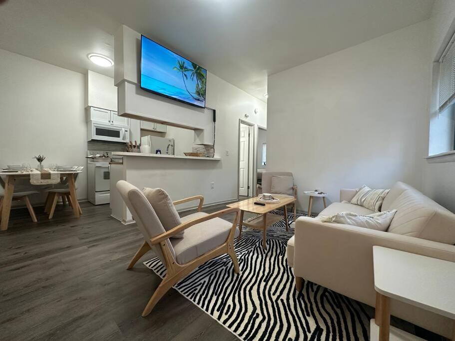 a living room with a couch and a table at GREAT VALUE Luxe Style Queen Beds WD Parking in Schenectady