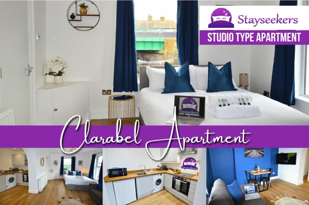 a bedroom with a large bed with blue and white pillows at Clarabel Studio Apartment - Stayseekers in Salisbury