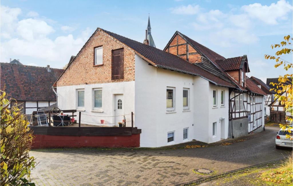 a large white house with a turret at 1 Bedroom Lovely Apartment In Nieheim in Nieheim
