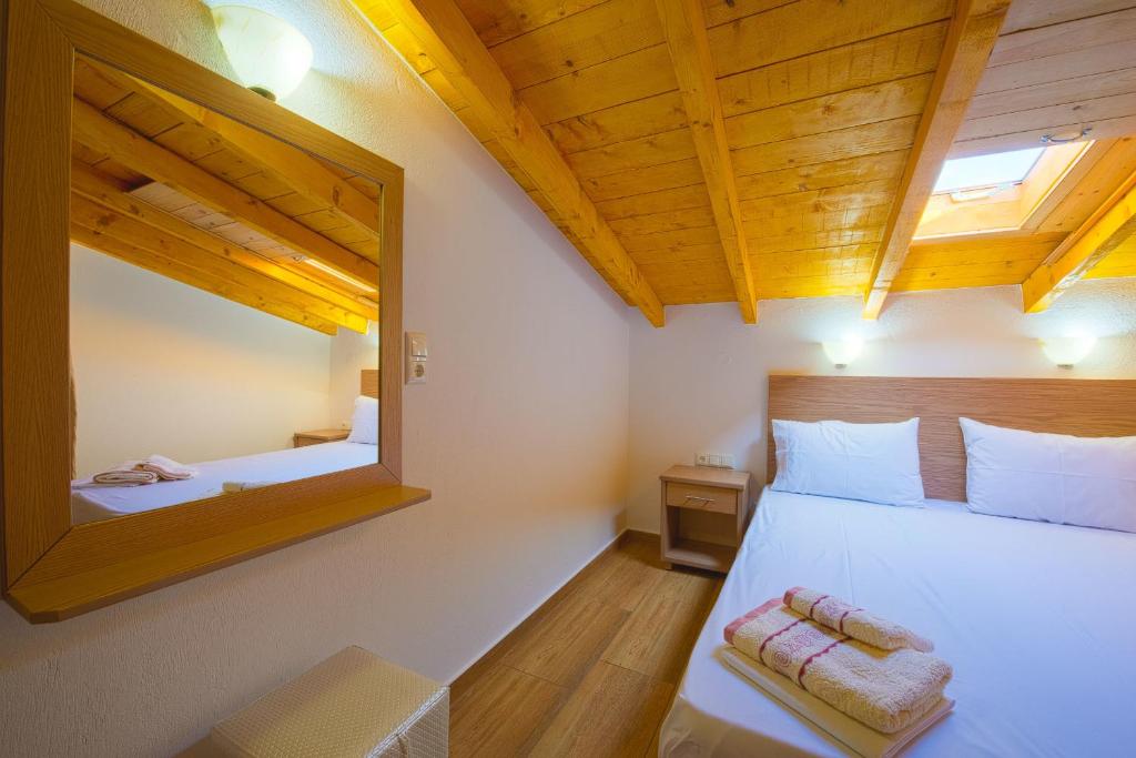 Postel nebo postele na pokoji v ubytování Studios Aspa