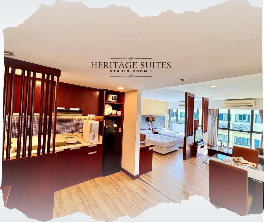 a hotel room with a bedroom and a living room at Studio Exclusive Swimming pool view by HERITAGE SUITES Near IMAGO Mall City Central , FREE HIGHSPEED WIFI & NETFLIX , KOTA KINABALU in Kota Kinabalu