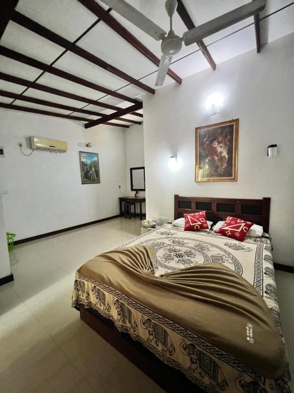Postel nebo postele na pokoji v ubytování Sylvester Villa Hostel Negombo