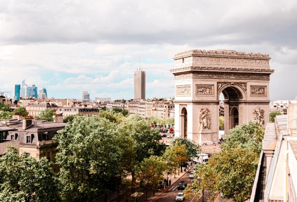a view of the city of vienna from the roofs of buildings at Grand Hôtel Champs-Elysées in Paris
