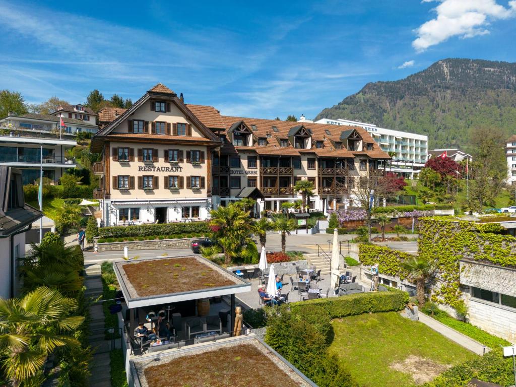 an aerial view of a hotel with a resort at See & Wellnesshotel Gerbi in Weggis