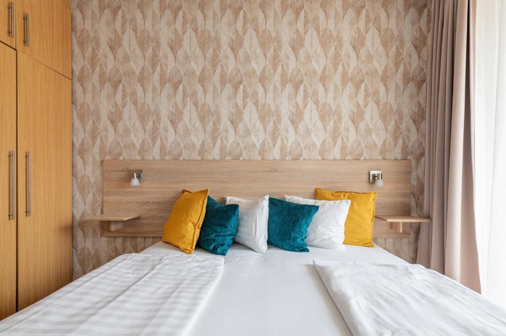 Posteľ alebo postele v izbe v ubytovaní Nova Apartments