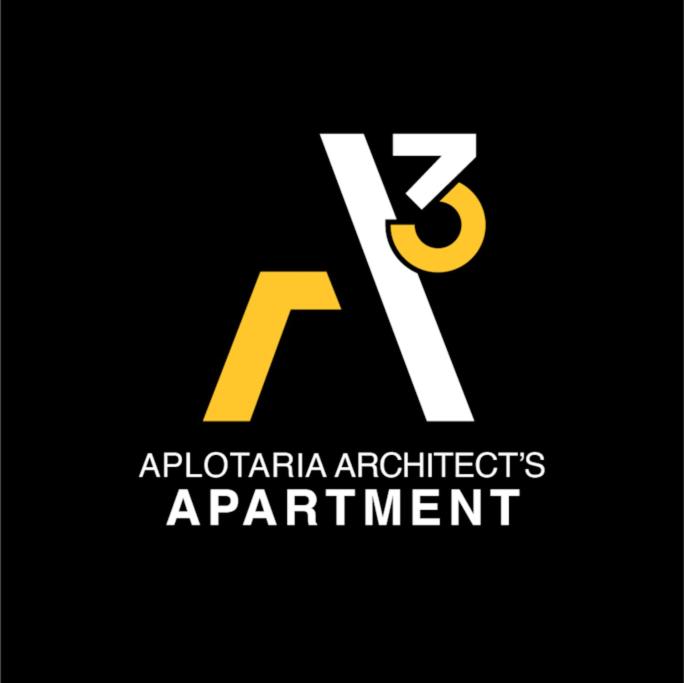 ein gelber und weißer Buchstabe k und ein Logo in der Unterkunft A3_Aplotaria Architect's Apartment in Chios