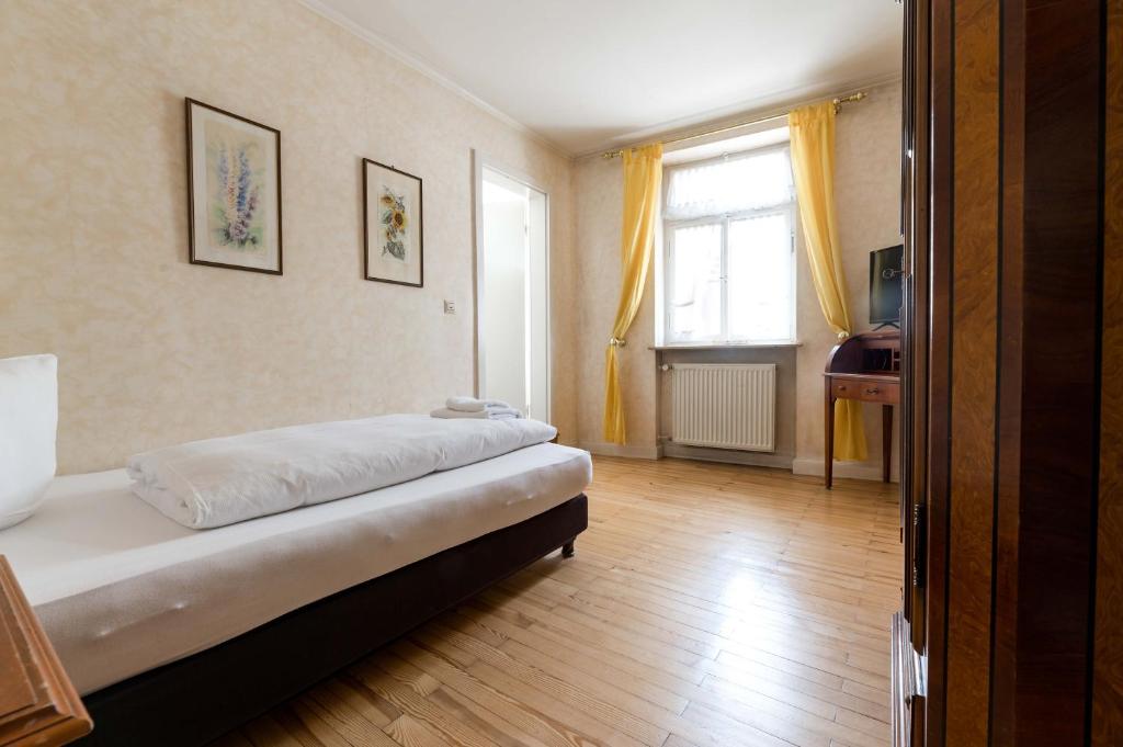 Postel nebo postele na pokoji v ubytování Hotel Leone d´Oro