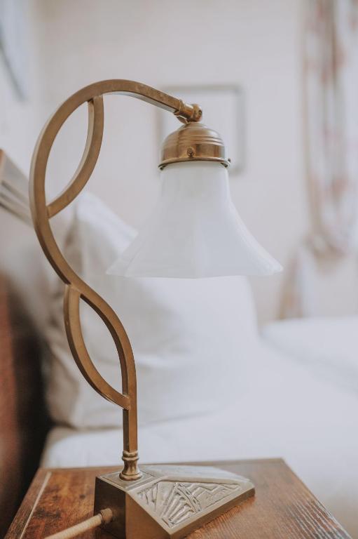 Postel nebo postele na pokoji v ubytování Hotel Leone d´Oro