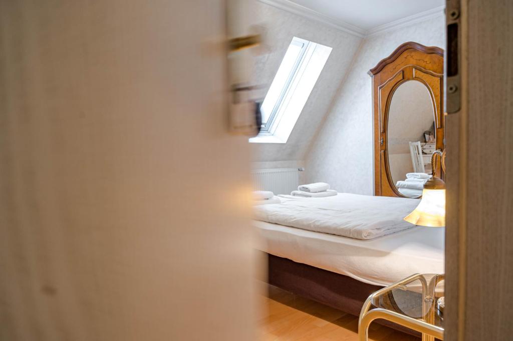 Postel nebo postele na pokoji v ubytování Hotel Leone d´Oro