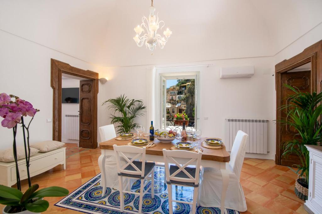 a dining room with a table and chairs at Casa Don Ciccio Positano in Positano