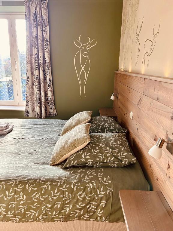 Postel nebo postele na pokoji v ubytování Taos B&B