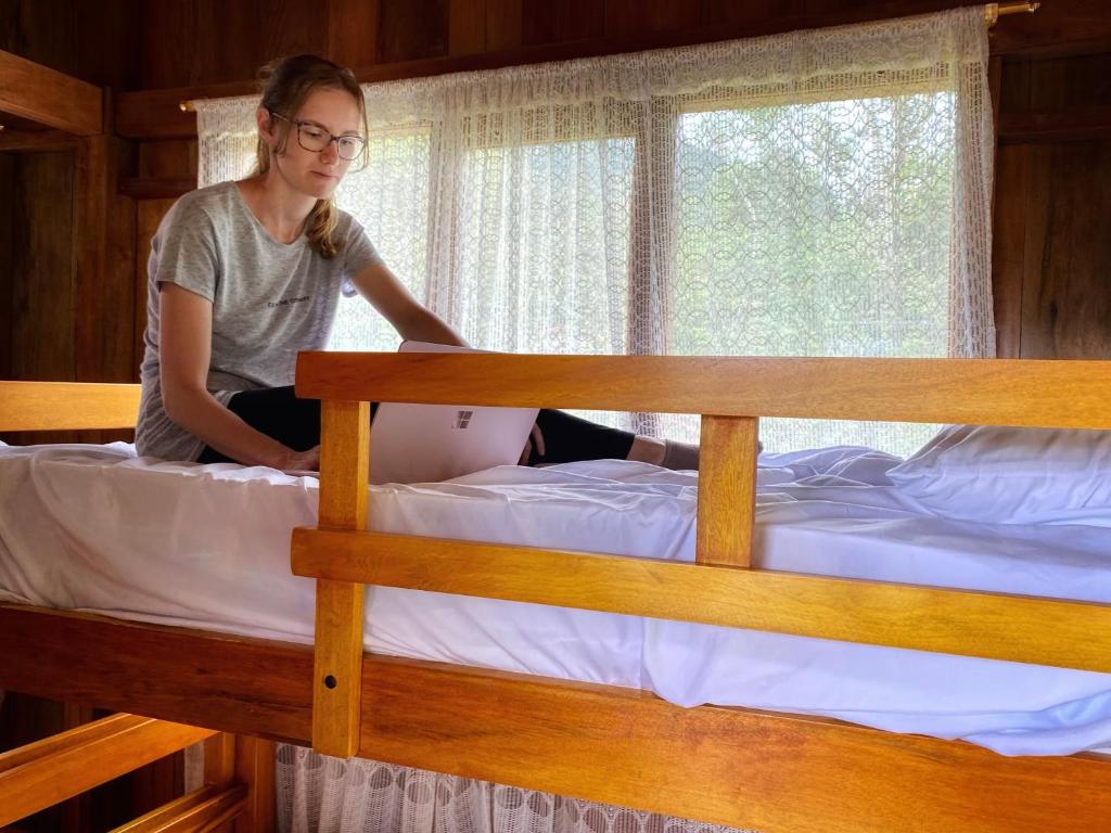 Postel nebo postele na pokoji v ubytování Inti Mindo Hostel