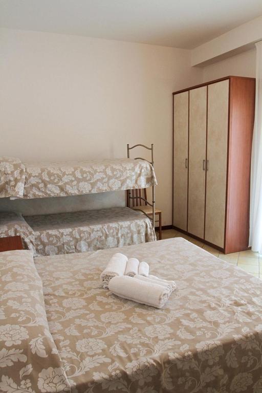Postel nebo postele na pokoji v ubytování Hotel Ariston