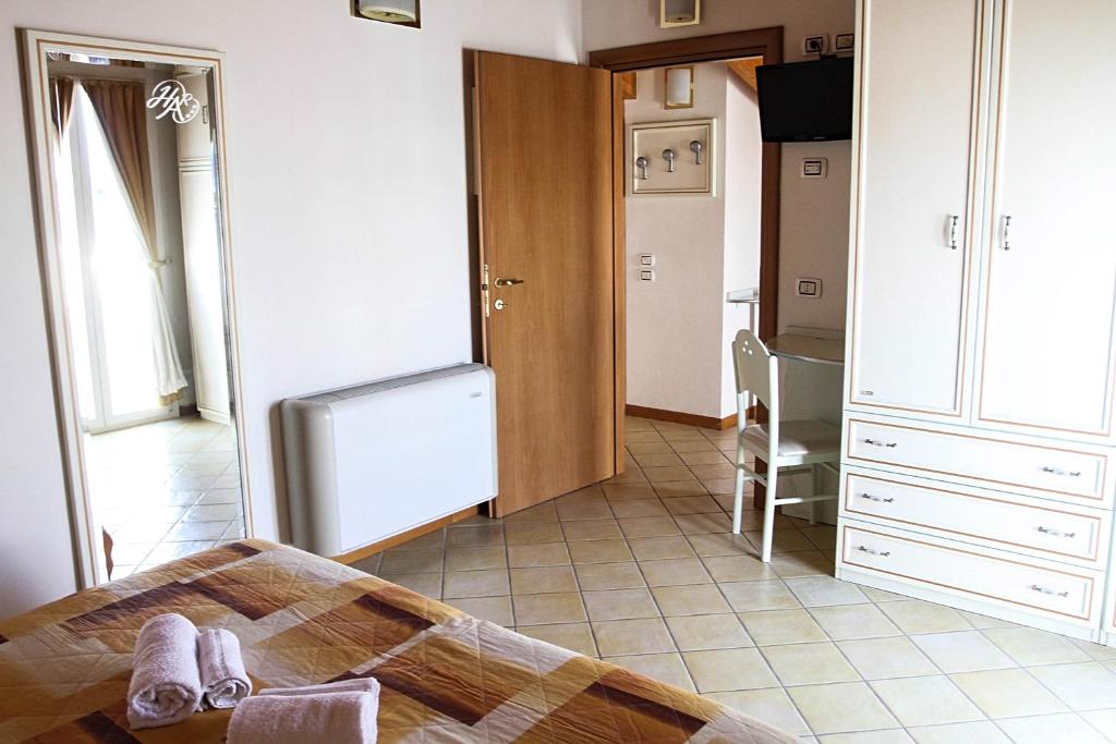 Postel nebo postele na pokoji v ubytování Hotel Ariston