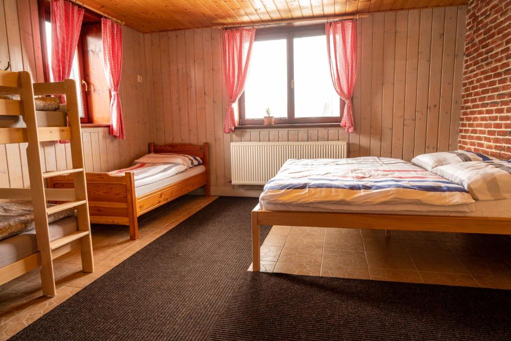 Postel nebo postele na pokoji v ubytování Chata Východná