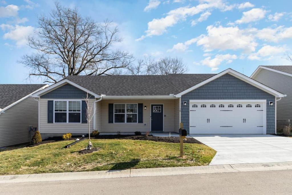 a house with a garage at Home among the Nook in Hamilton Ohio in Hamilton