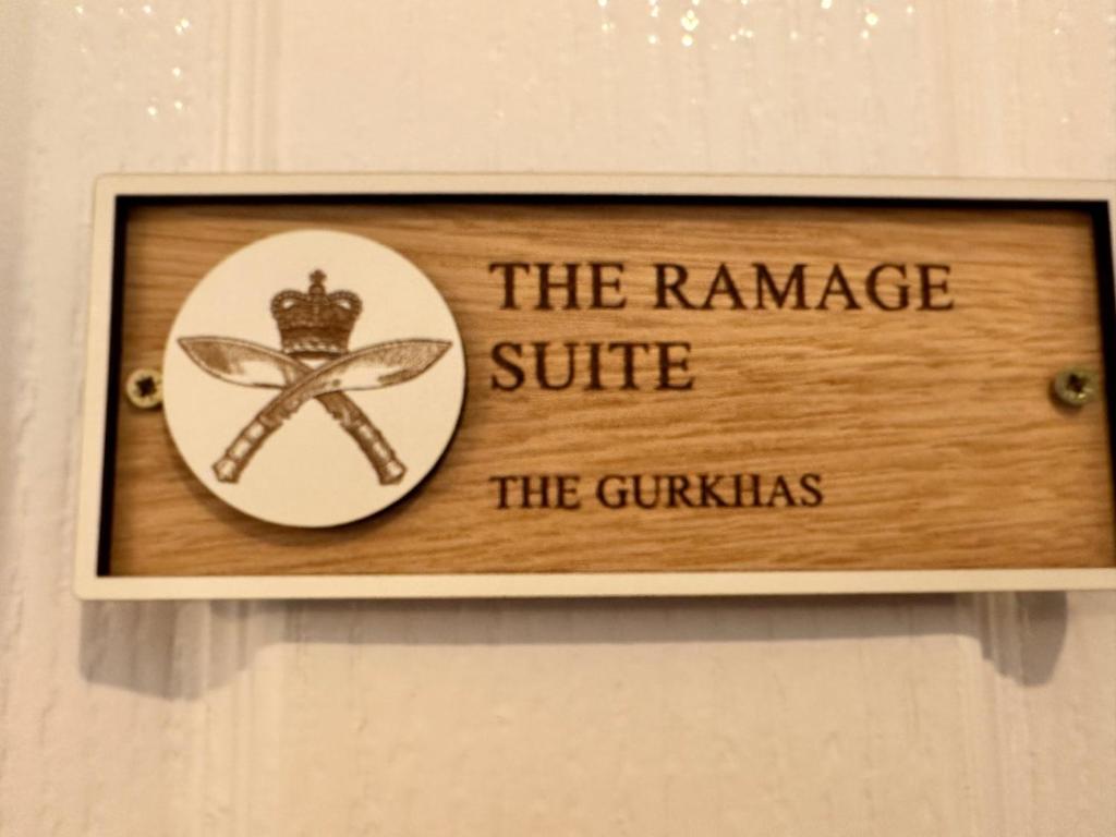 a sign that reads the ramesesiesie the guillekiss at Forces Manor in Kincraig