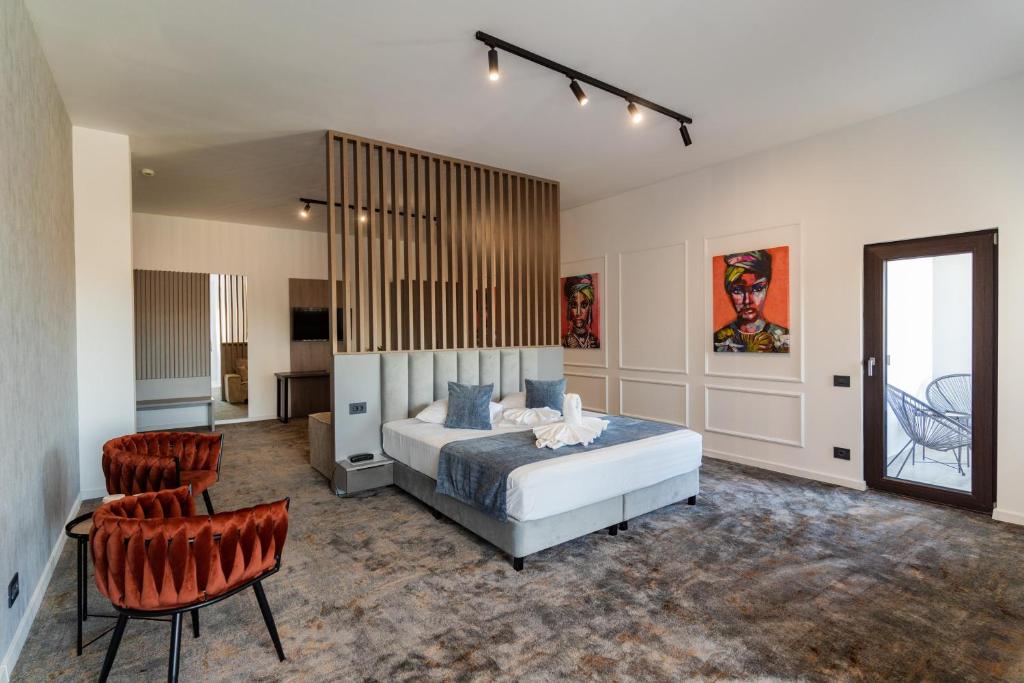 Ένα ή περισσότερα κρεβάτια σε δωμάτιο στο Hotel Luxor