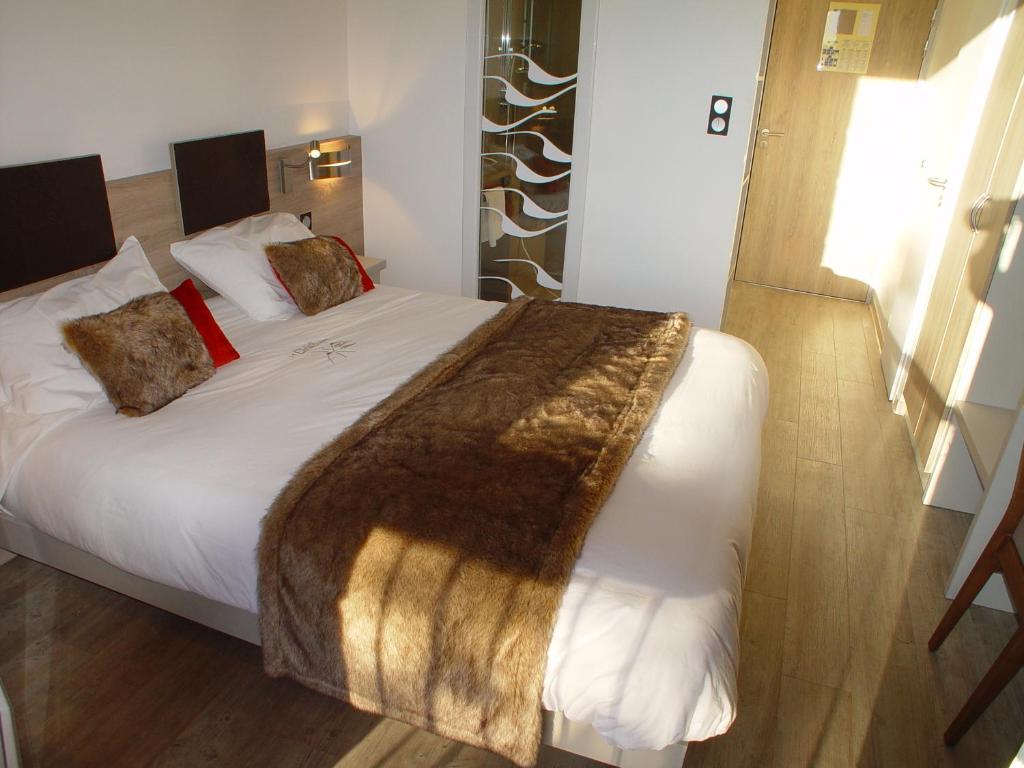 Postel nebo postele na pokoji v ubytování Hotel et Résidence Le Clos Cerdan