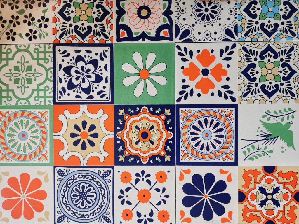 a set of colorful tiles with flowers and birds at Church Retreat - A Magnificent Seaside Apartment-Award Winning in Hastings