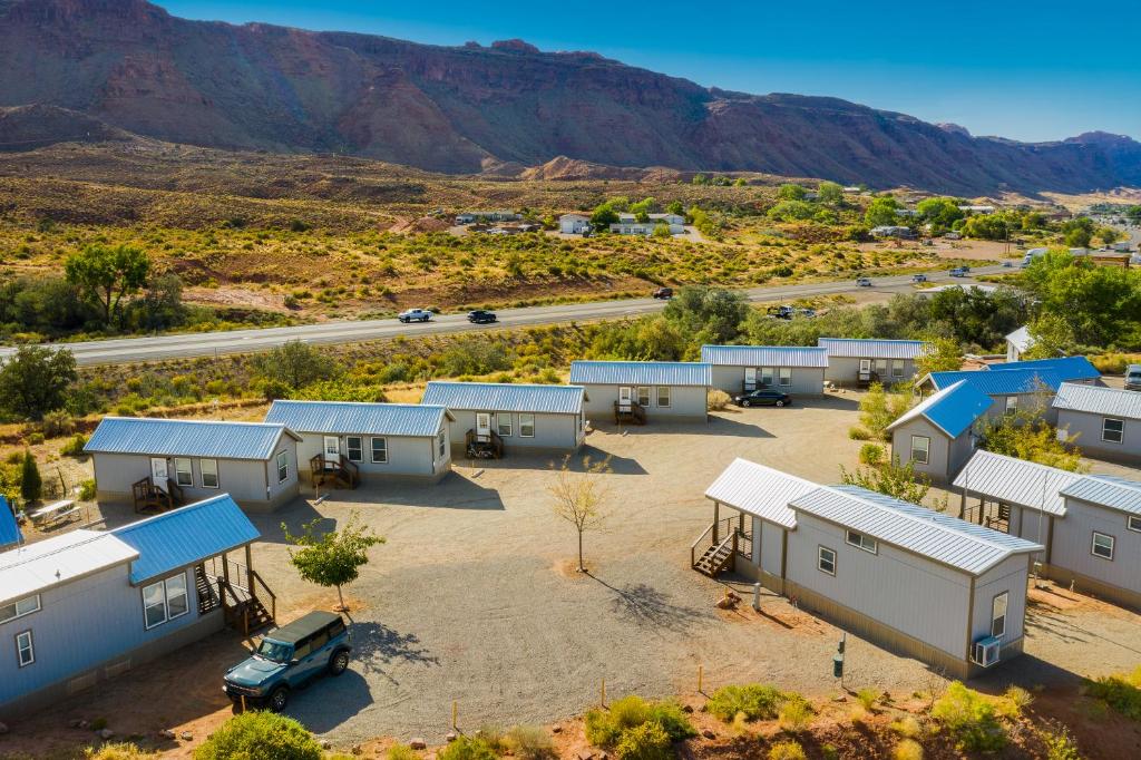 an aerial view of a motel with mountains in the background at HTR Moab in Moab
