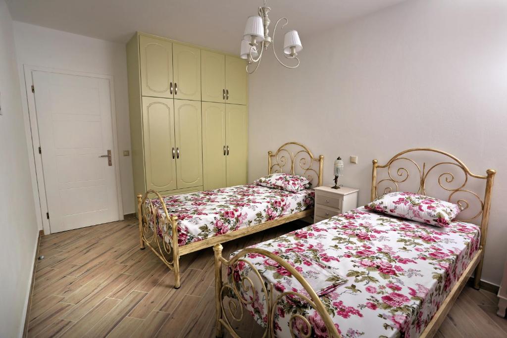 A bed or beds in a room at Petra & Thalassa