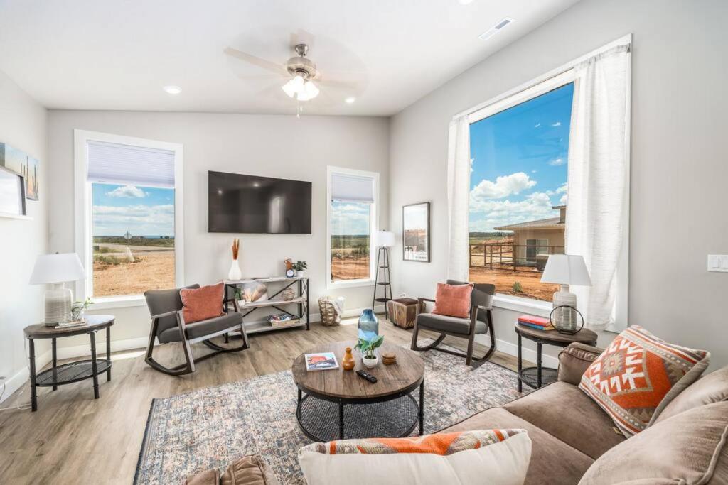 a living room with a couch and a table at High Desert luxury with views for families in Kanab