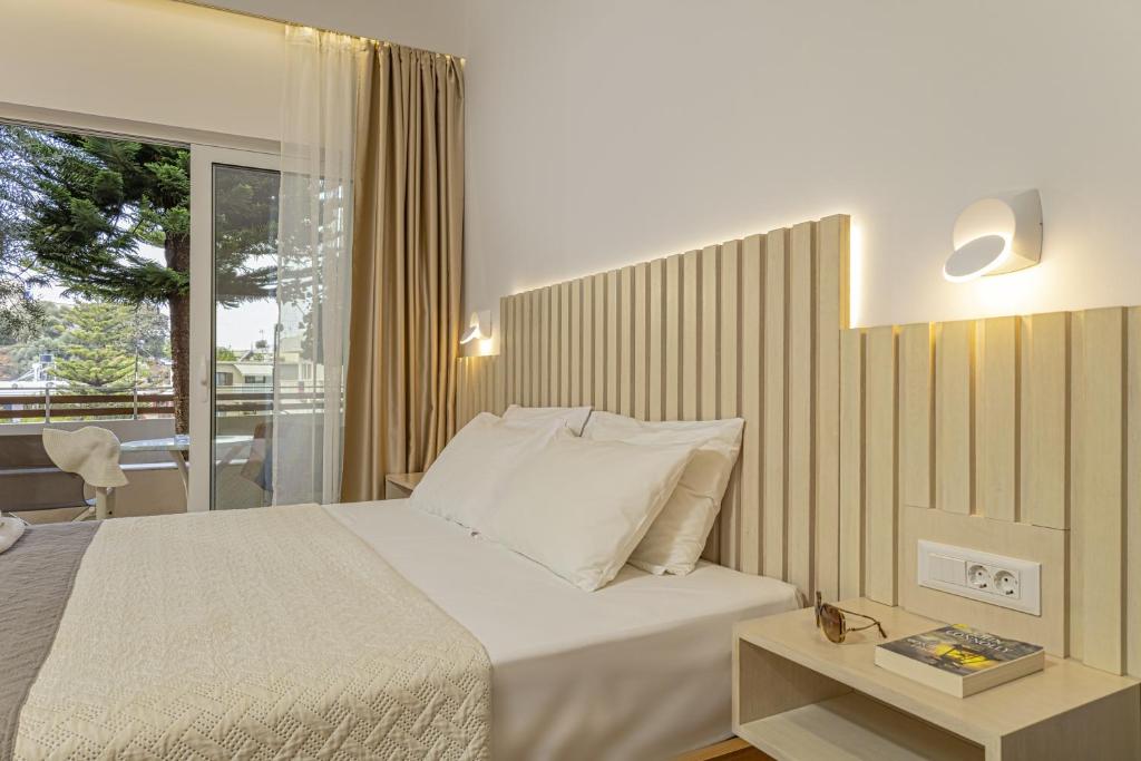 Posteľ alebo postele v izbe v ubytovaní Theos Village Apartments