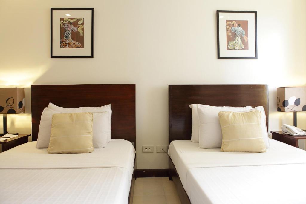 Postel nebo postele na pokoji v ubytování Alba Uno Hotel