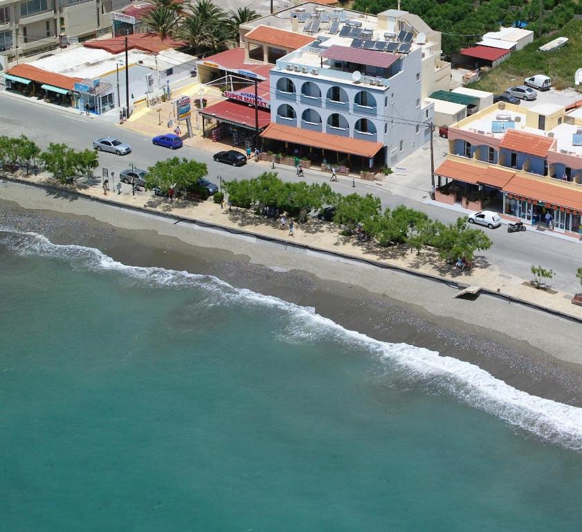 an aerial view of a street and the ocean at Hotel Livikon in Plakias