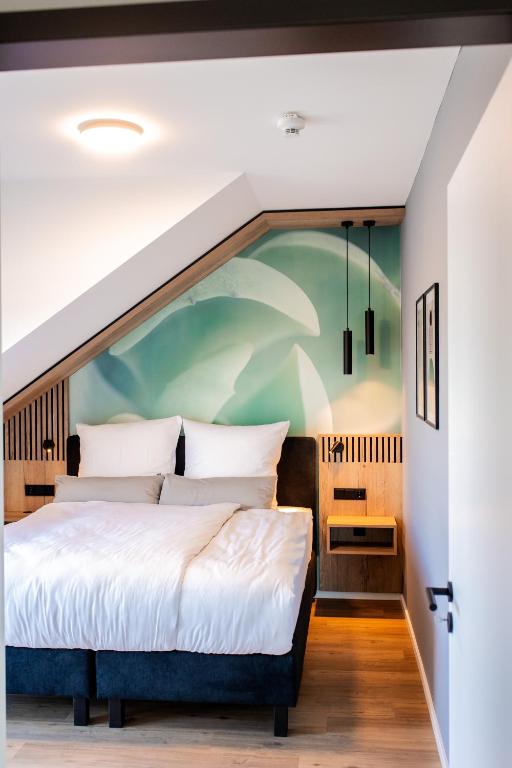 Postel nebo postele na pokoji v ubytování Boardinghouse Hense