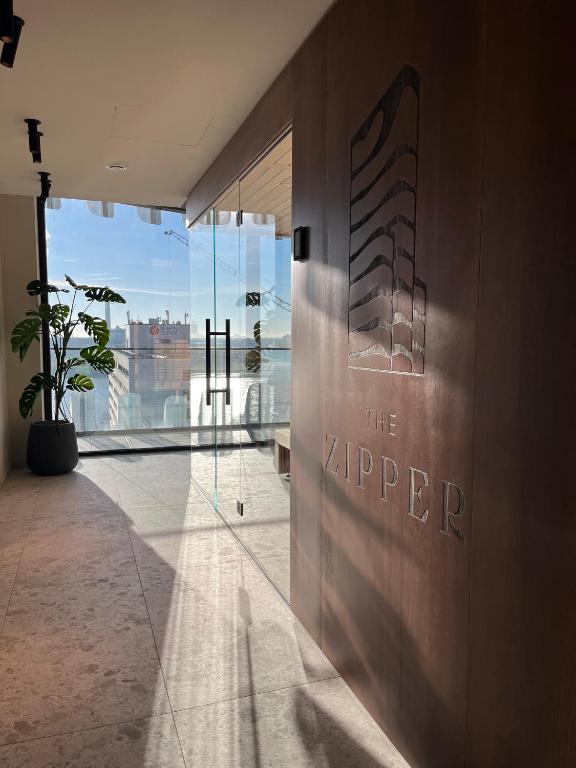 a lobby with a sign on the side of a building at The Zipper Hotel und Apartments in Düsseldorf