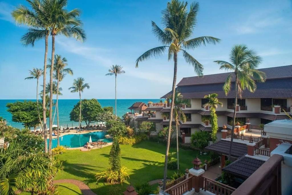 an aerial view of the resort with the ocean in the background at Aloha Resort in Lamai