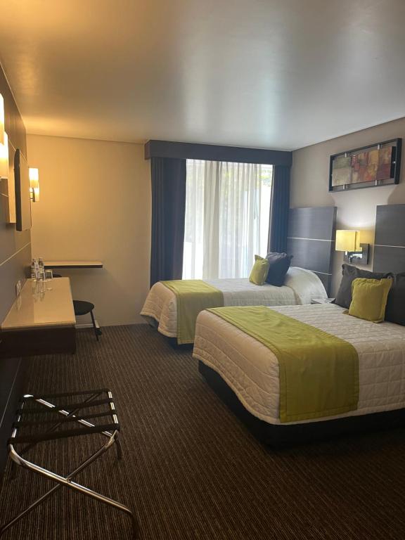 Postel nebo postele na pokoji v ubytování Hotel Real Alameda de Queretaro
