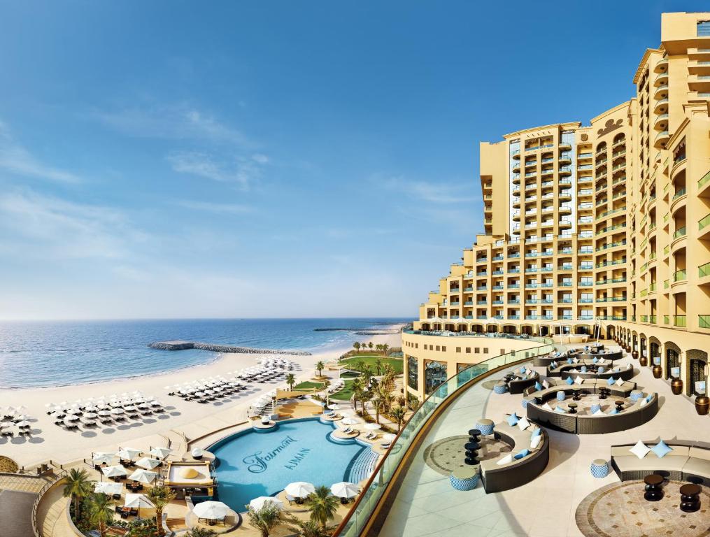 a view of a resort with a beach and the ocean at Fairmont Ajman in Ajman 