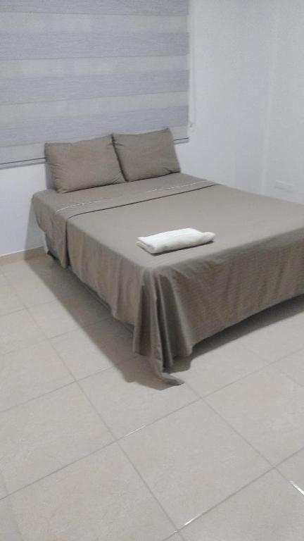 Postel nebo postele na pokoji v ubytování lujoso apartamento