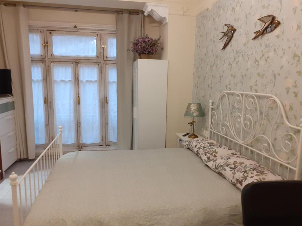 Postel nebo postele na pokoji v ubytování Uría 25 rooms