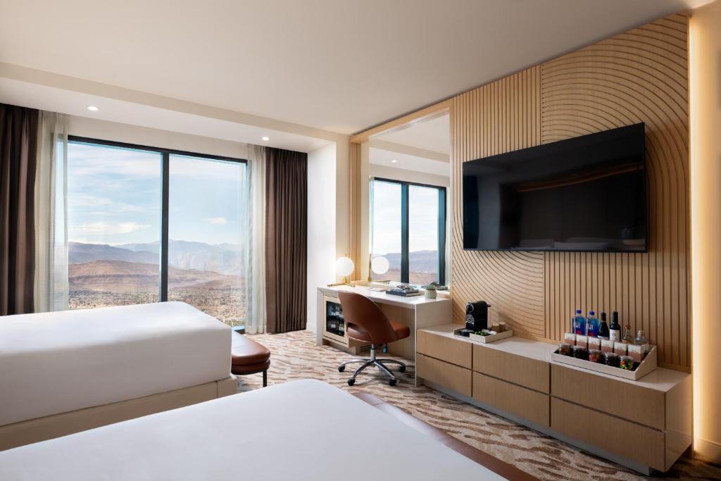 Ein Bett oder Betten in einem Zimmer der Unterkunft Durango Casino &amp; Resort